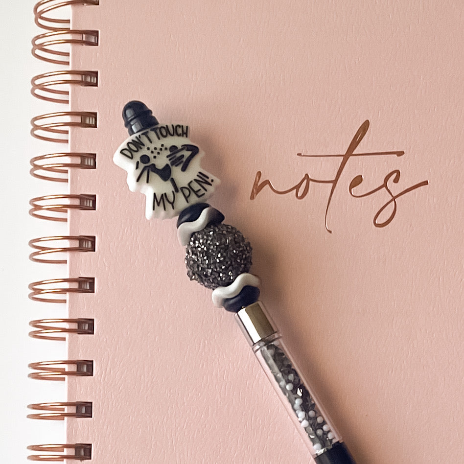 Handmade black and silver beaded pen featuring a Don’t Touch My Pen focal bead and sparkling accent bead.