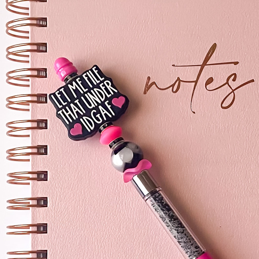 Handmade pink beaded pen featuring Let Me File That Under IDGAF focal bead with black and pink accents